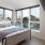 Bedroom with natural lighting and high ceilings